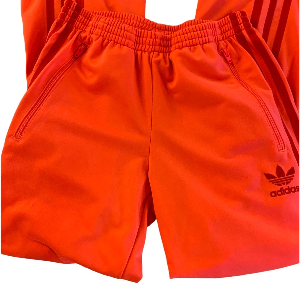 Adidas Orange track pants with dark orange 3 stripes side pickets with zippers